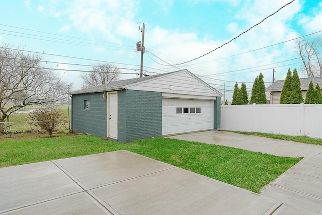 garage featuring a lawn