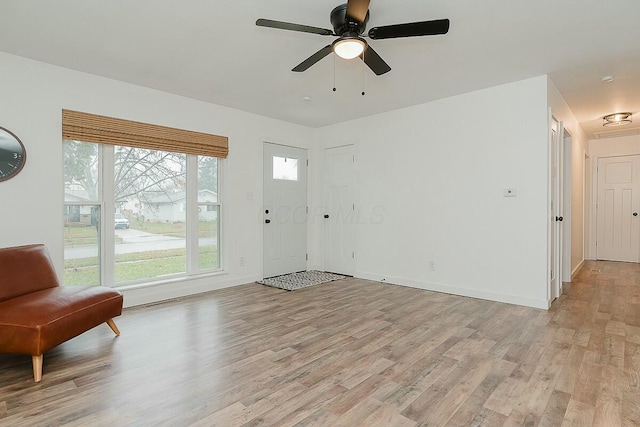 foyer featuring ceiling fan and light wood-type flooring