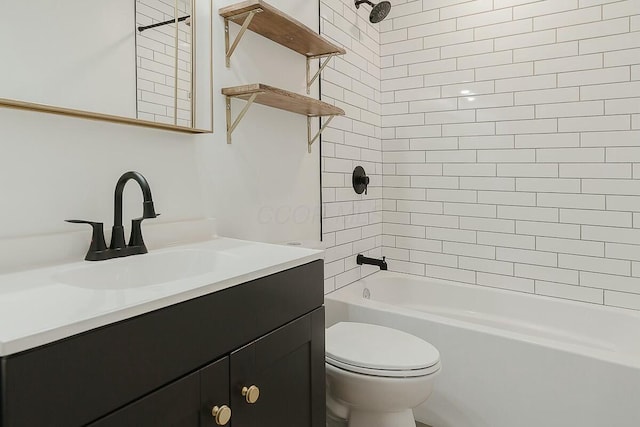 full bathroom featuring vanity, toilet, and tiled shower / bath