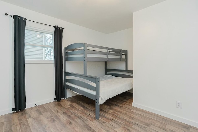 unfurnished bedroom featuring hardwood / wood-style flooring