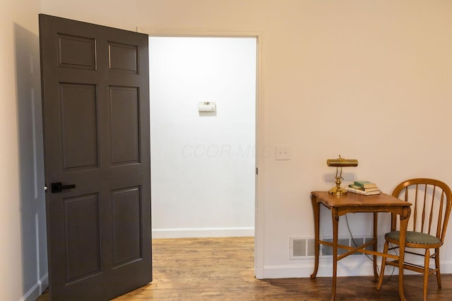 corridor featuring light hardwood / wood-style floors