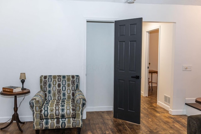 living area with dark hardwood / wood-style floors