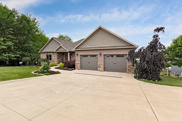 craftsman house featuring a front yard and a garage