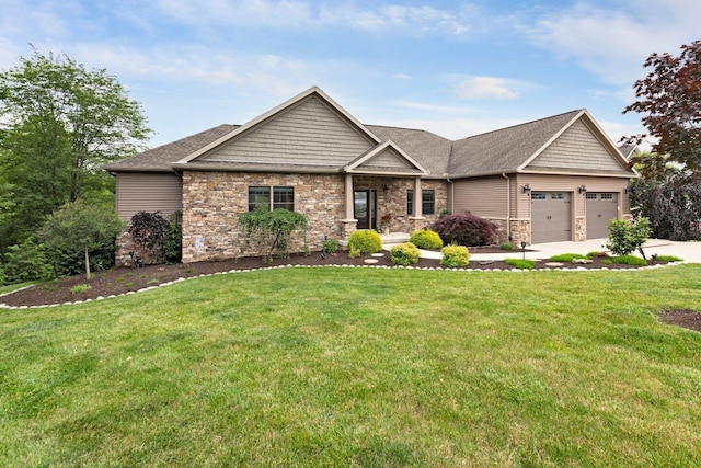 craftsman house featuring a garage and a front yard