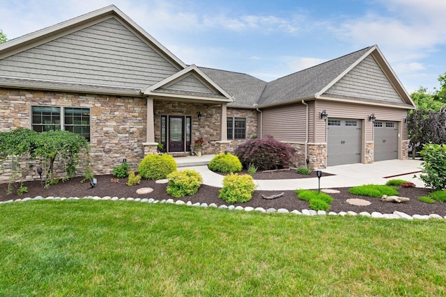 craftsman-style home with a garage and a front lawn