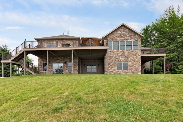 rear view of property featuring a lawn and a wooden deck