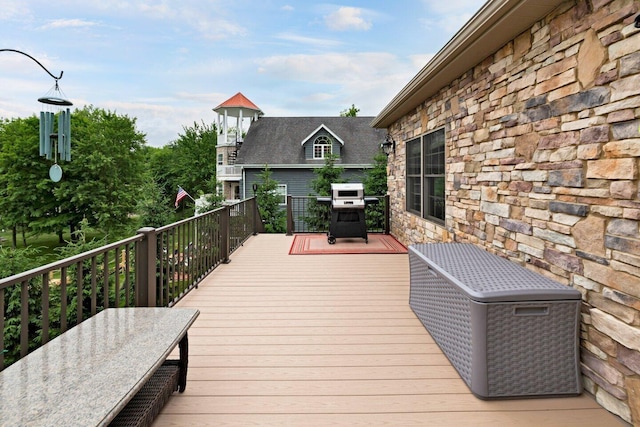 wooden deck with area for grilling