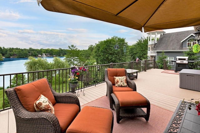 wooden deck featuring a water view