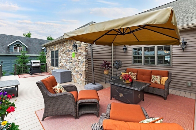 wooden terrace featuring an outdoor living space and a grill