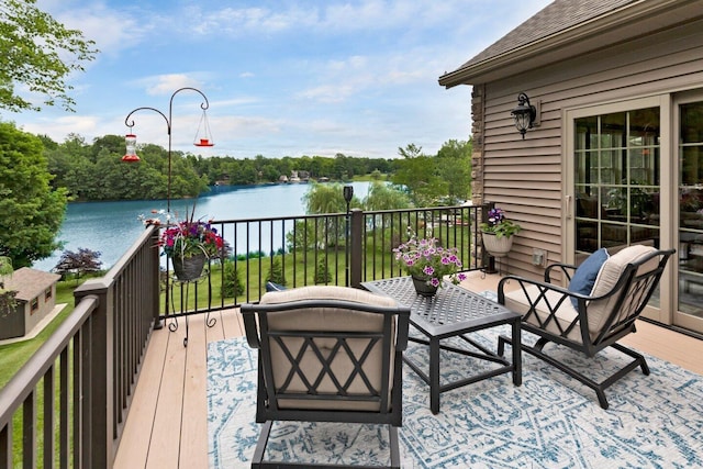 deck featuring a water view