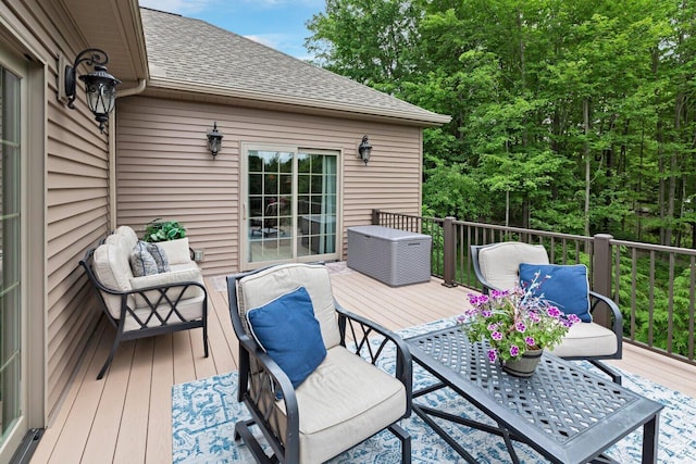 wooden deck featuring outdoor lounge area