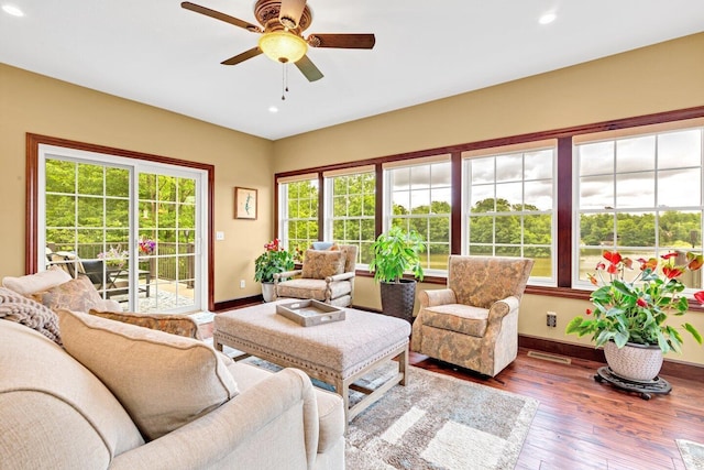 sunroom / solarium with ceiling fan