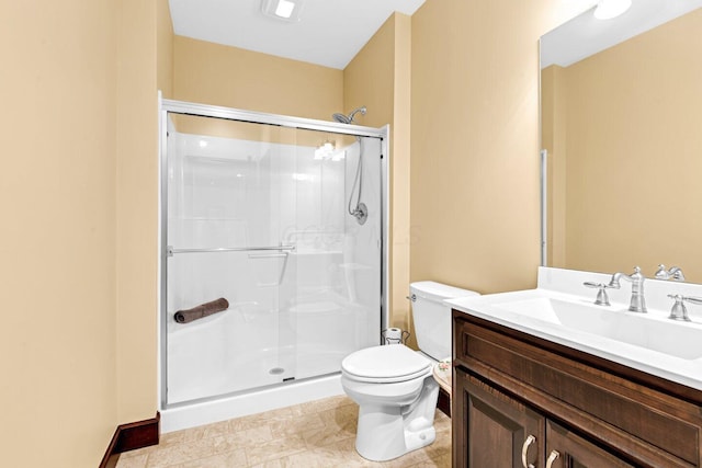 bathroom featuring tile patterned flooring, vanity, toilet, and a shower with door