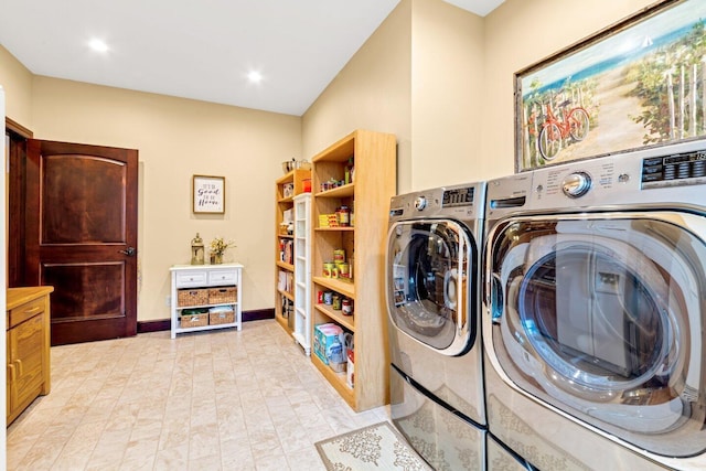 clothes washing area featuring washer and clothes dryer