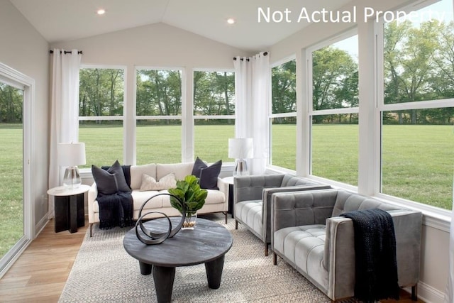 sunroom / solarium with vaulted ceiling