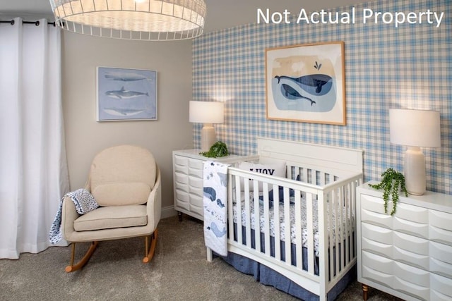 bedroom with carpet floors and a crib