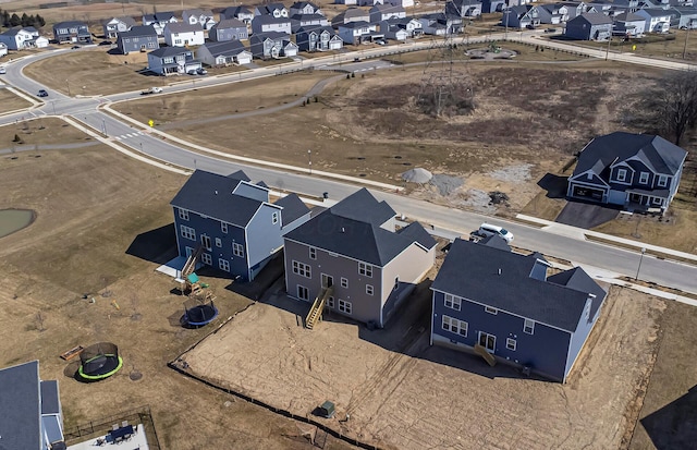 birds eye view of property with a residential view
