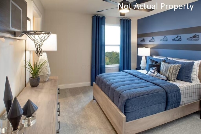 bedroom featuring ceiling fan and light carpet