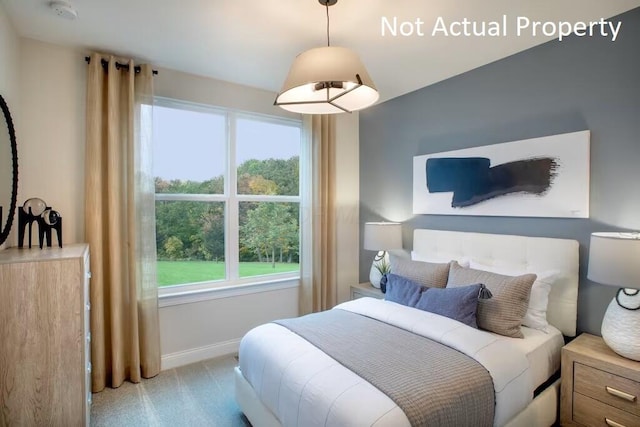 bedroom with light colored carpet