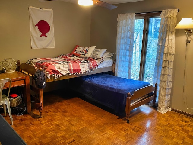 bedroom with parquet flooring and ceiling fan