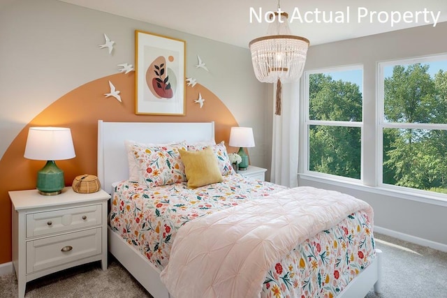 bedroom featuring light colored carpet and a notable chandelier