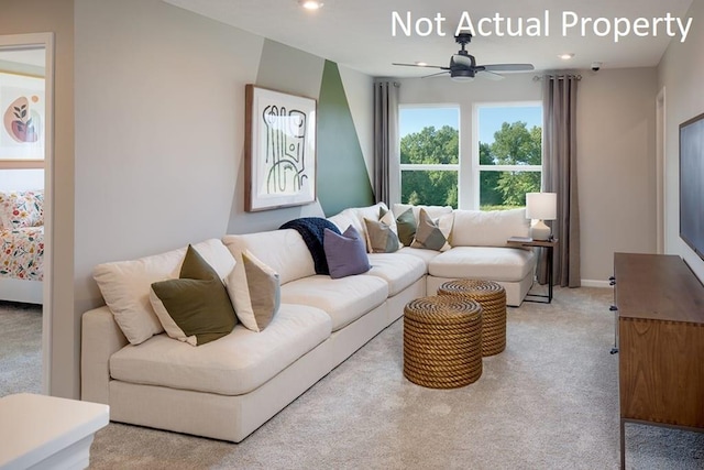 living room featuring ceiling fan and light colored carpet