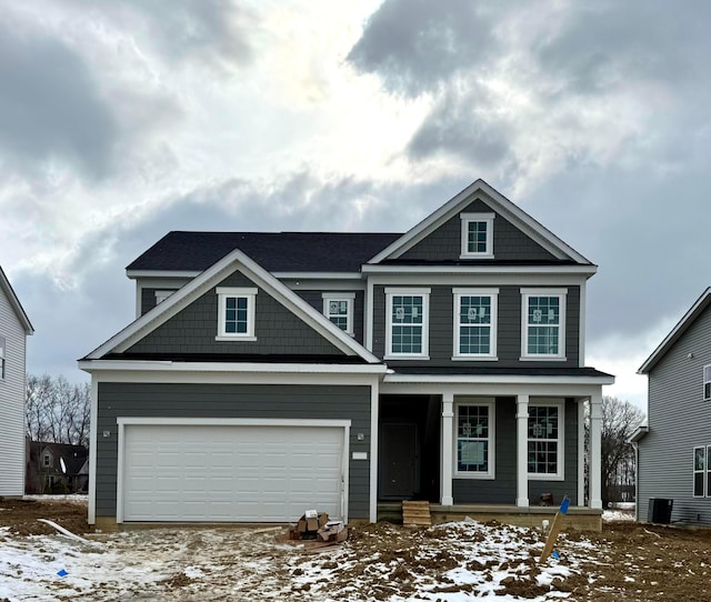 view of front facade featuring a garage and covered porch