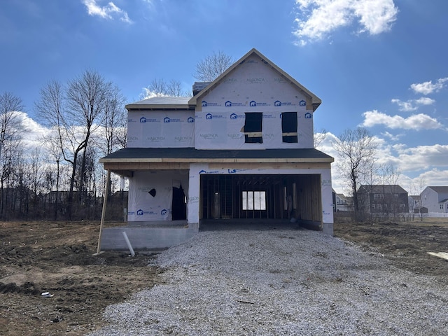 property under construction featuring a garage and driveway