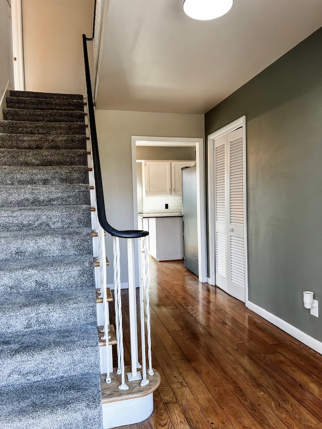 staircase featuring hardwood / wood-style flooring