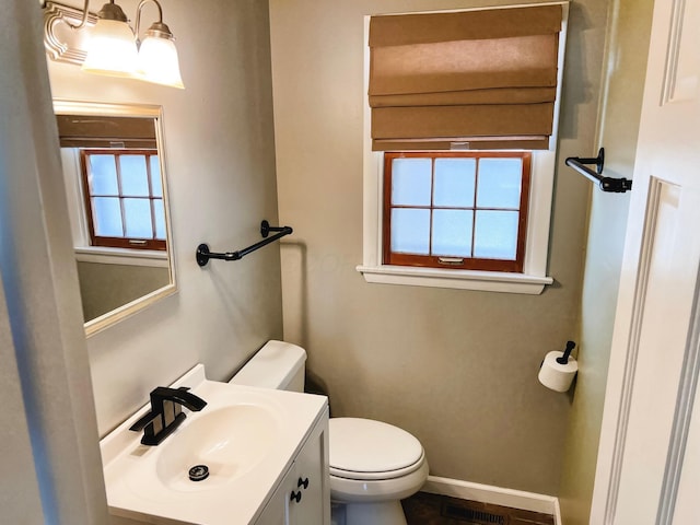 bathroom with vanity and toilet