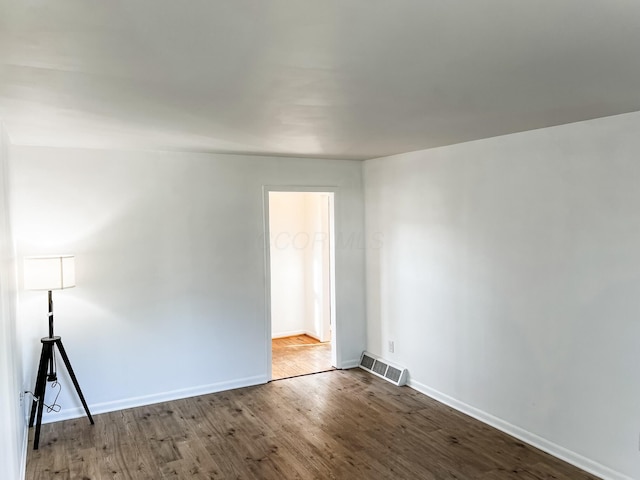 spare room featuring hardwood / wood-style flooring