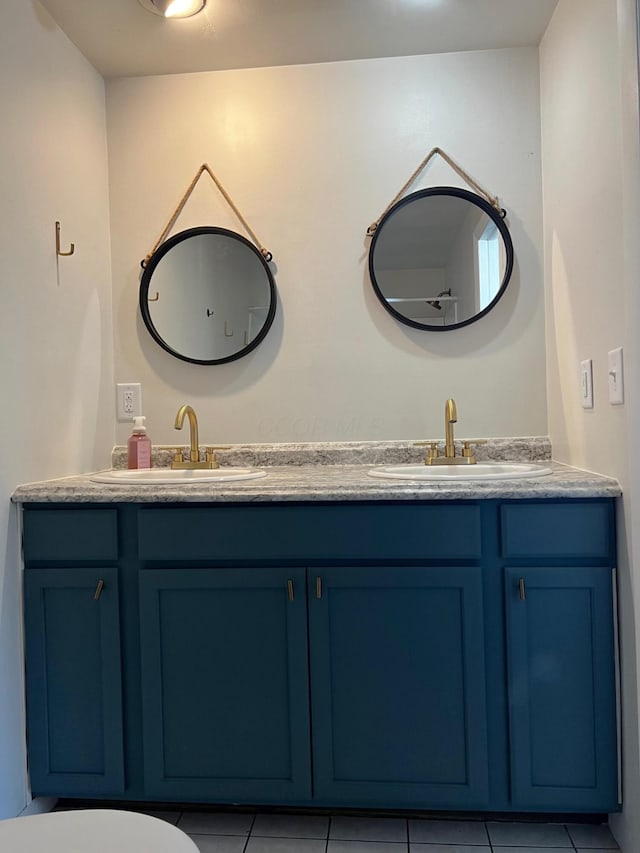 bathroom with tile patterned flooring and vanity