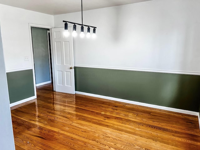 spare room with hardwood / wood-style floors