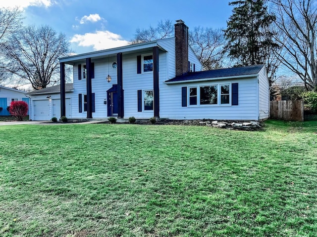 view of front of house featuring a front yard and a garage