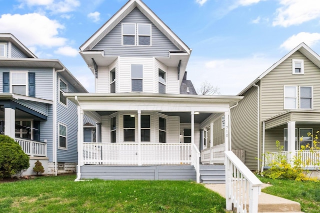 view of front facade with a porch and a front lawn