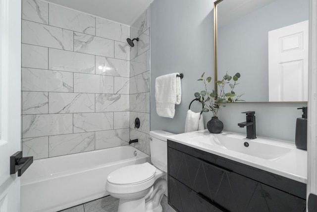 full bathroom featuring vanity, tiled shower / bath combo, and toilet