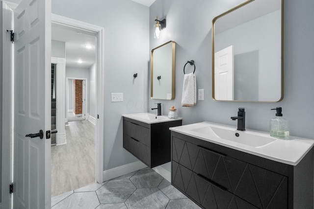 bathroom with vanity and wood-type flooring