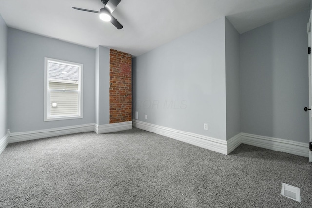 unfurnished living room featuring carpet flooring and ceiling fan