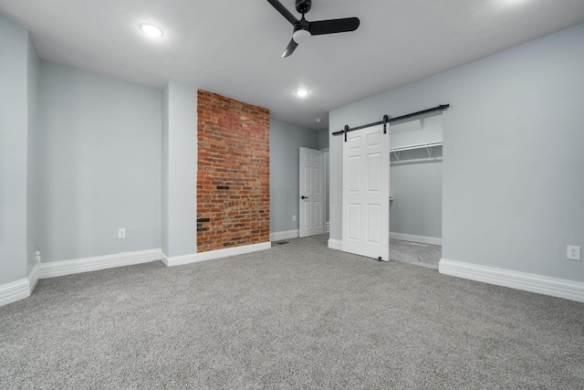 unfurnished bedroom featuring carpet flooring, ceiling fan, and a closet