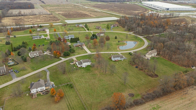 birds eye view of property with a rural view