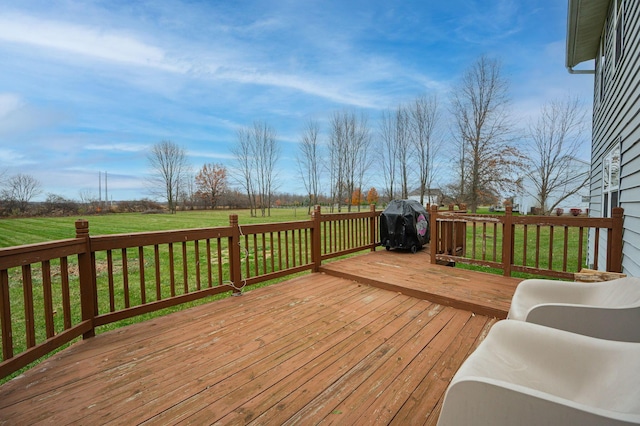 wooden deck featuring a lawn