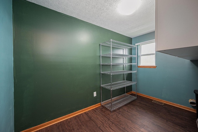 interior space featuring hardwood / wood-style floors and a textured ceiling