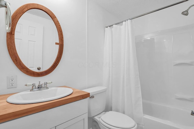 full bathroom featuring vanity, shower / bath combination with curtain, a textured ceiling, and toilet