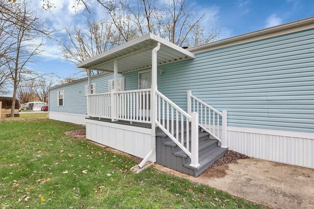 119 Skyline Dr, South Bloomfield, OH 43103 - view of exterior entry featuring a lawn