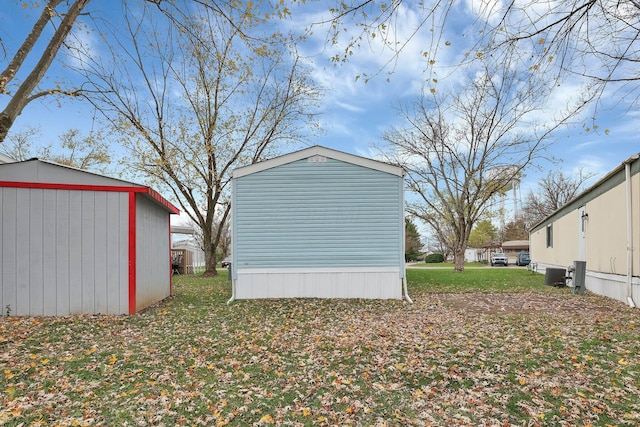 119 Skyline Dr, South Bloomfield, OH 43103 - view of home's exterior with a storage unit and a lawn