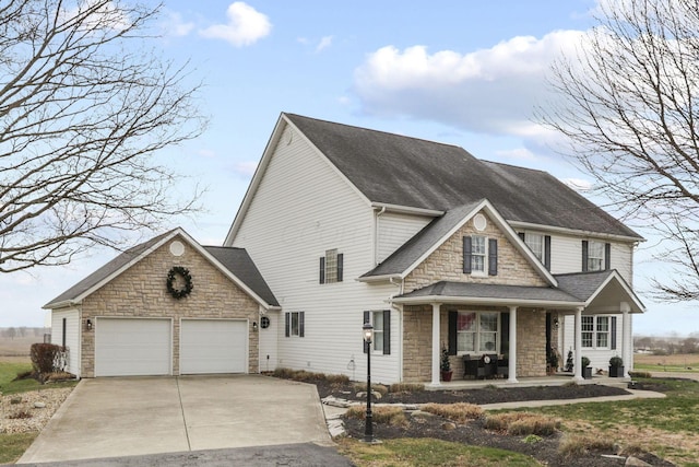 view of front of property with a garage and a porch