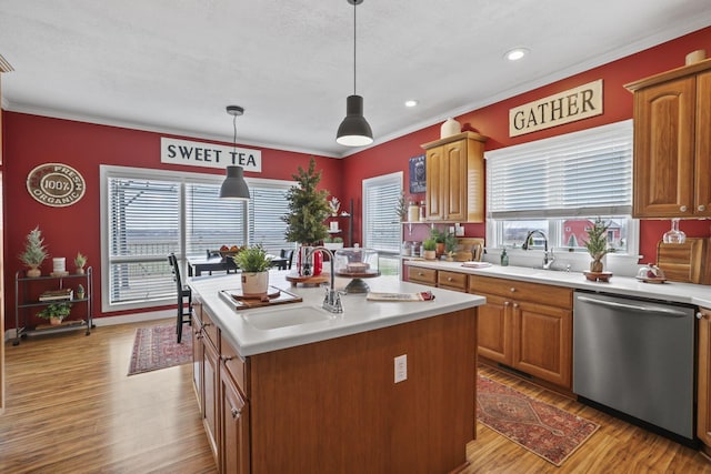 kitchen featuring plenty of natural light, light wood-type flooring, dishwasher, hanging light fixtures, and a kitchen island