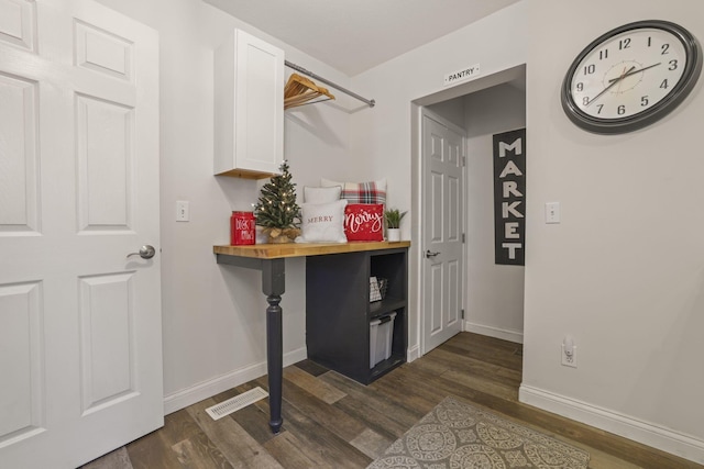 laundry room featuring dark hardwood / wood-style flooring