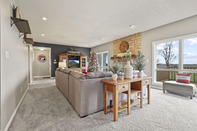 carpeted living room with a textured ceiling