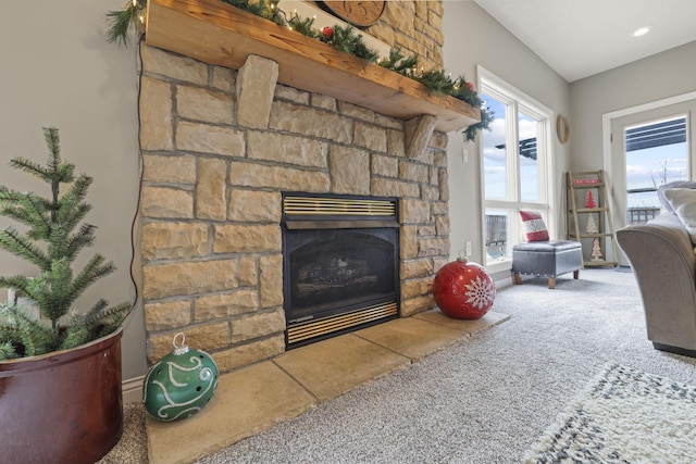 carpeted living room featuring a fireplace